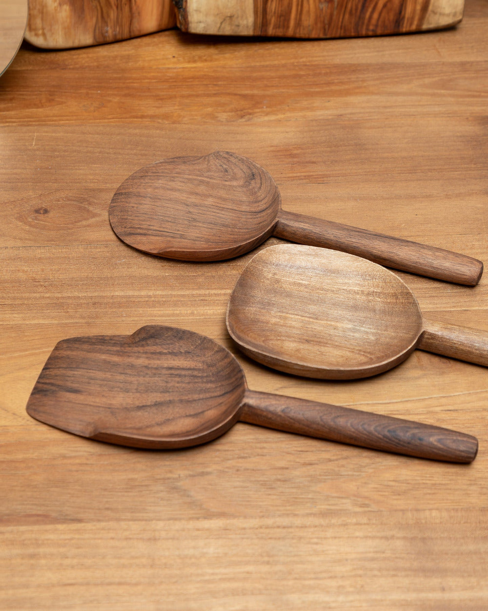 Set of wooden spoons on a wooden surface