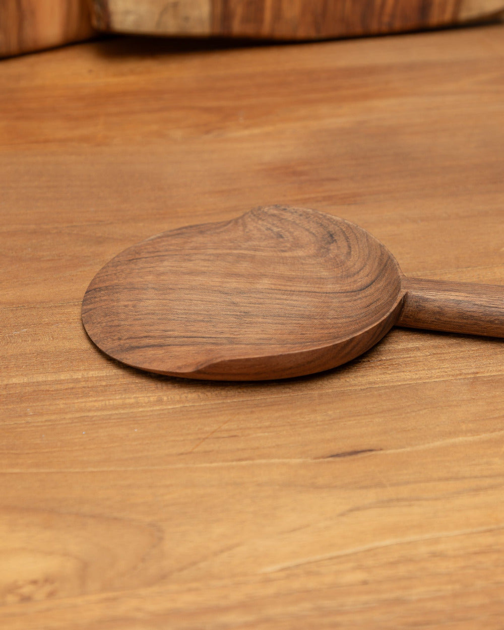 Wooden spoon on a wooden surface