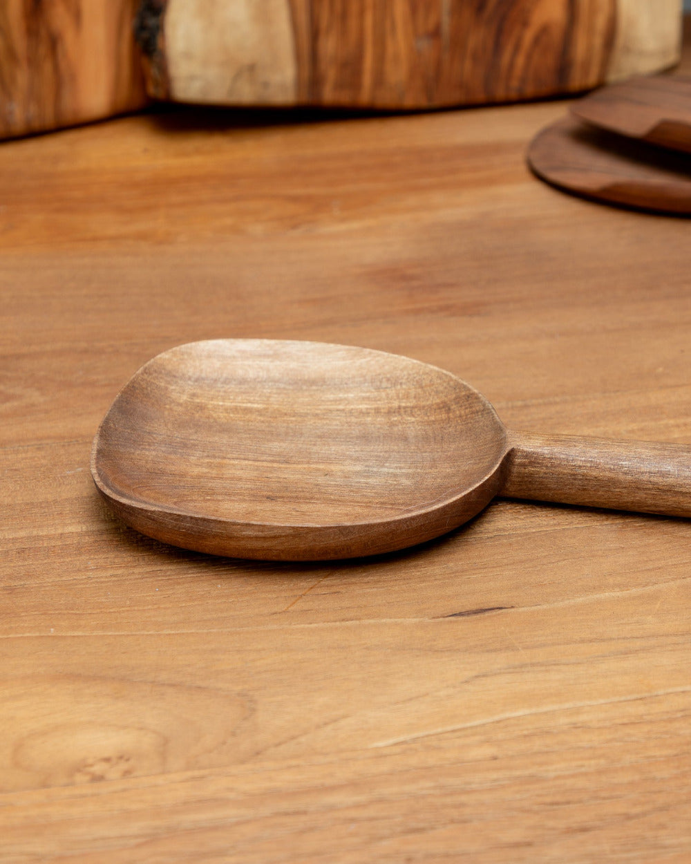 Wooden spoon on a wooden surface