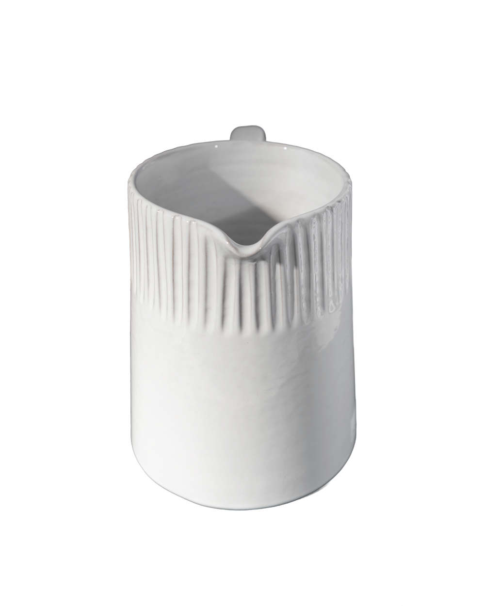 White ceramic pitcher with ribbed design on a white background