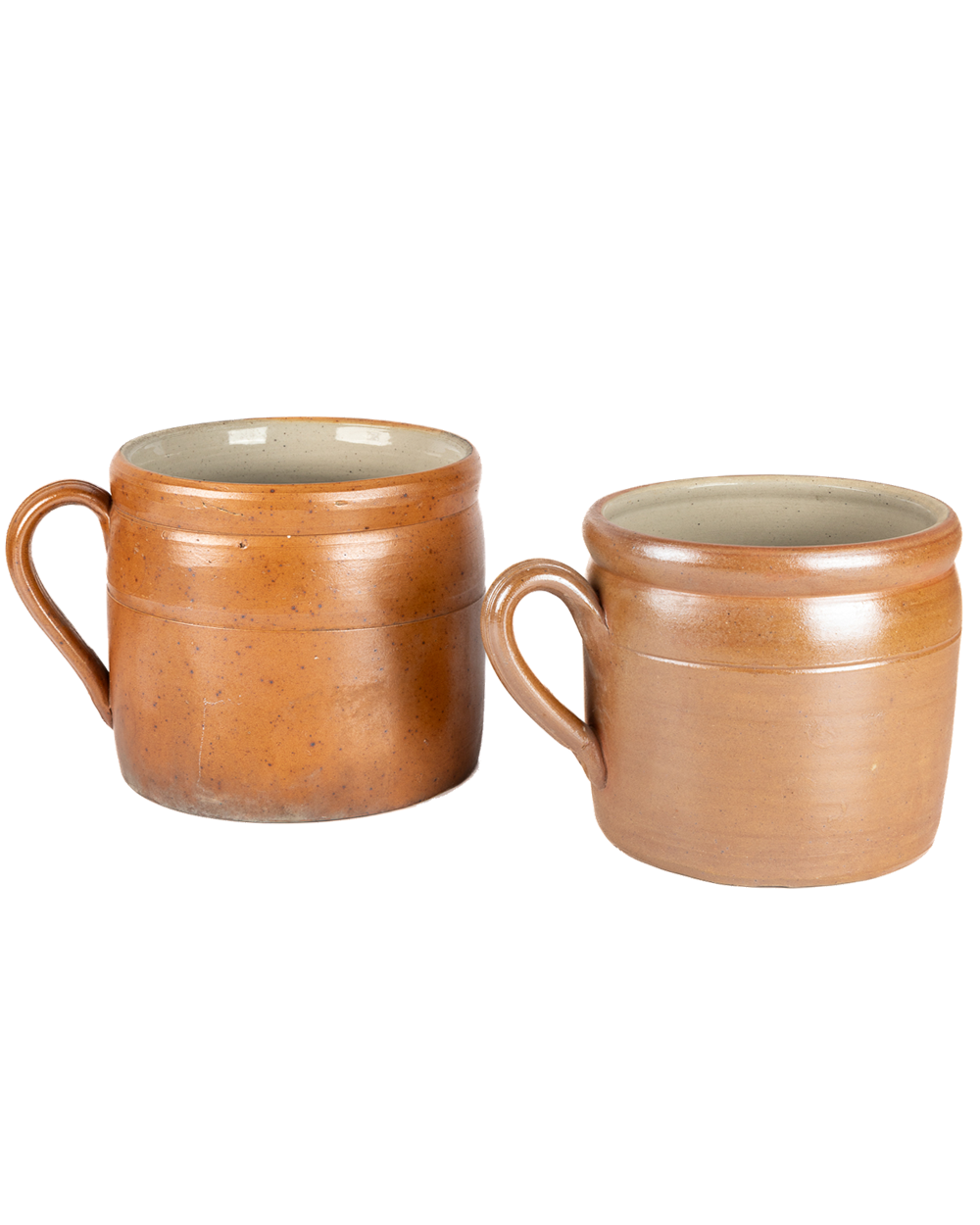 Two brown ceramic mugs on a white background