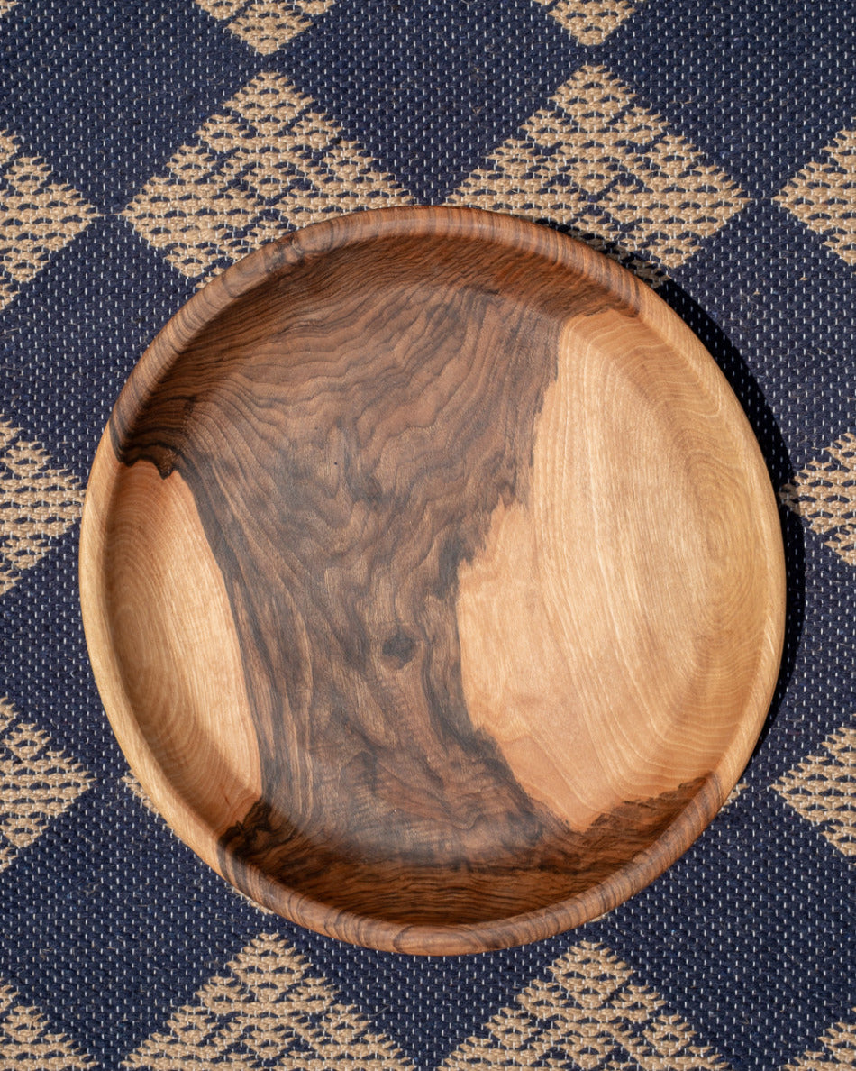 Wooden bowl with a checkered fabric background