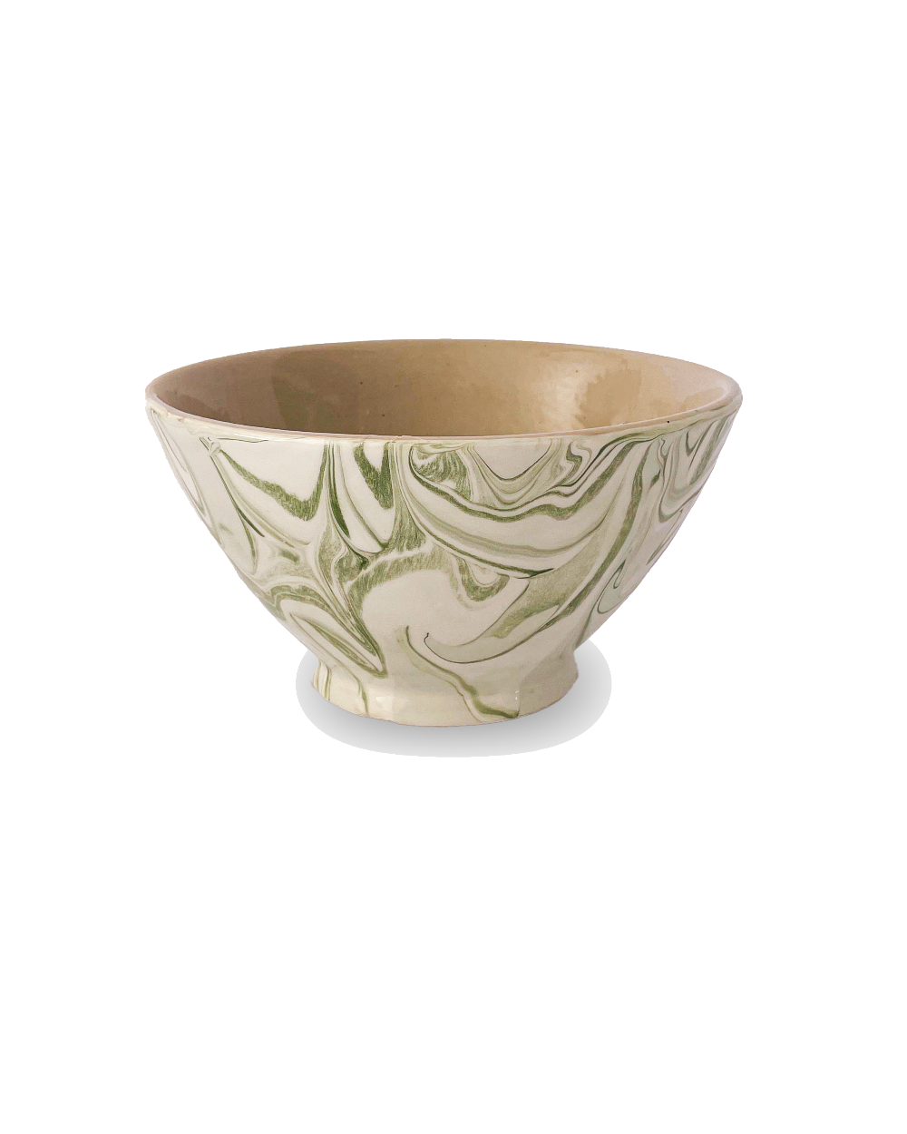 Ceramic bowl with green and beige marbled pattern on a white background