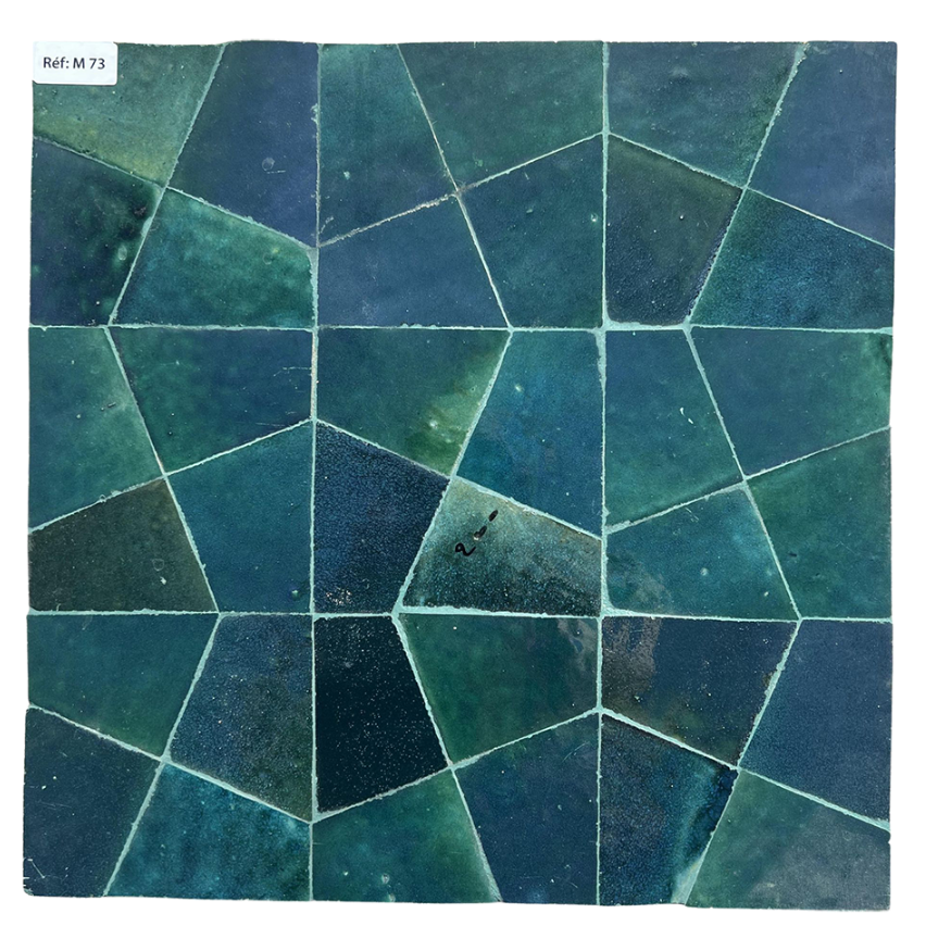 Geometric pattern of green and blue tiles on a white background