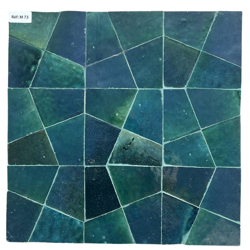 Geometric pattern of green and blue tiles on a white background