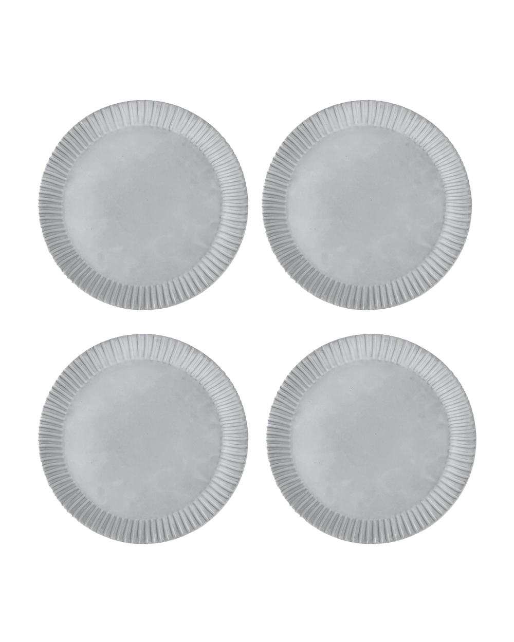 Set of four white plates with textured rim on a white background