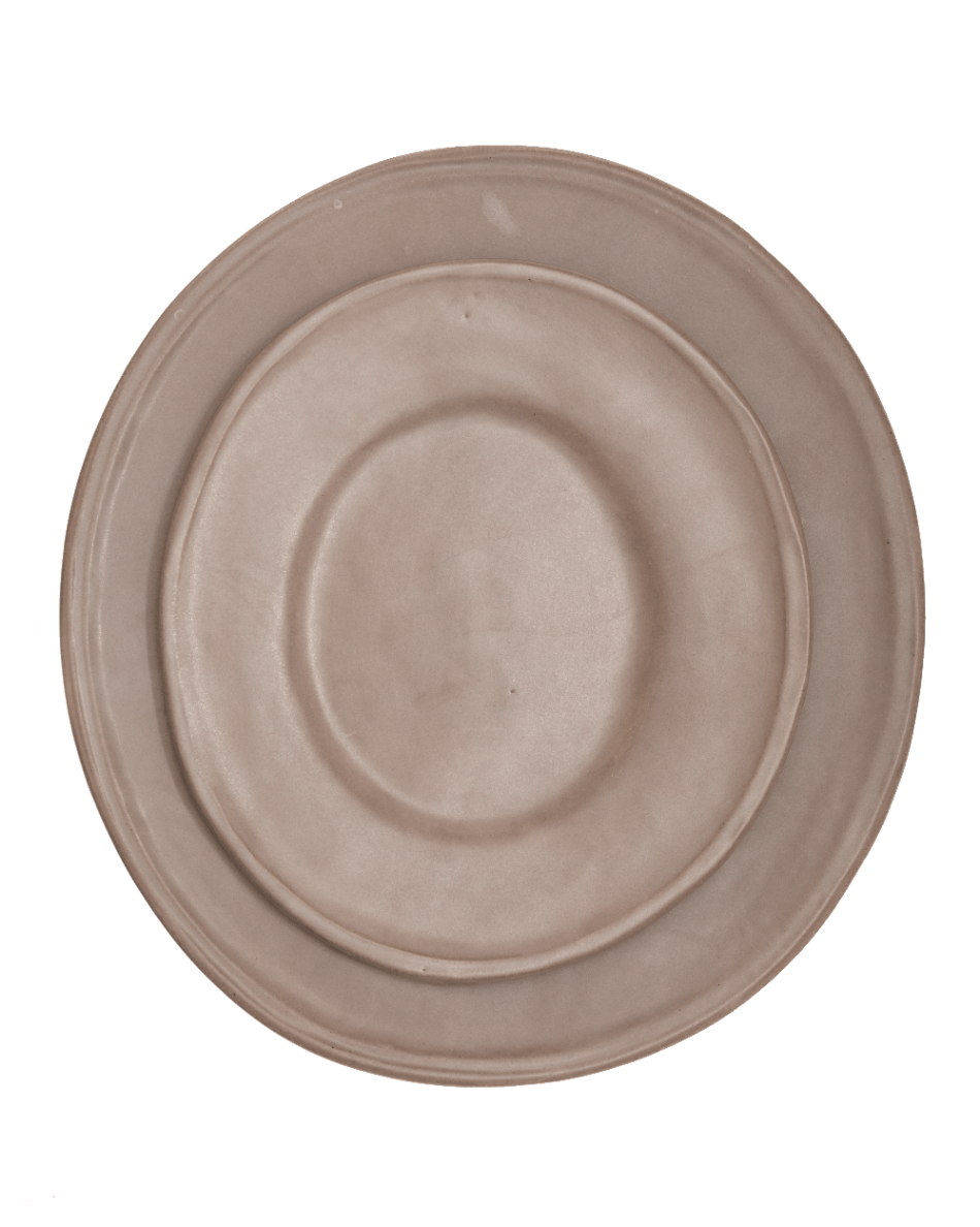 Oval beige ceramic plates on a white background