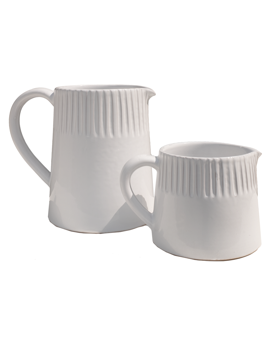 Two white ceramic mugs with ribbed texture on a white background
