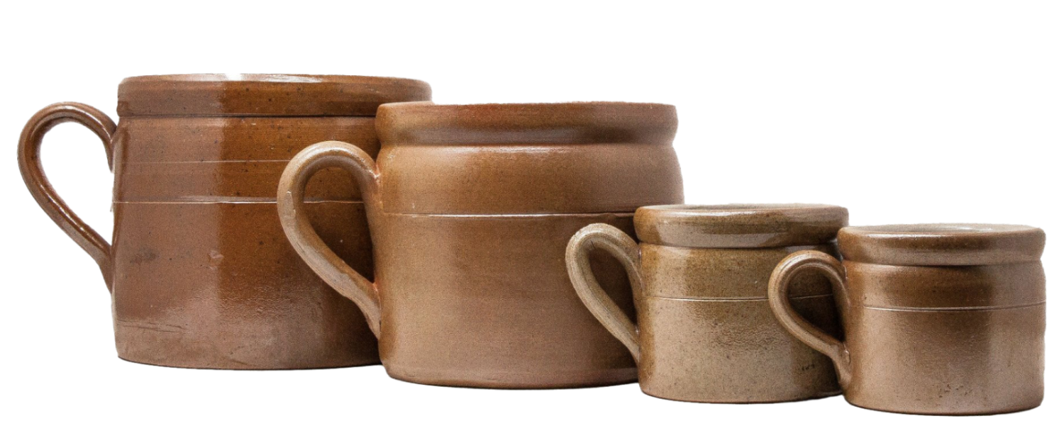Large and small brown ceramic crocks with handles of different sizes on a white background
